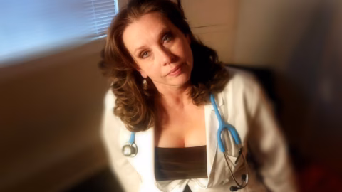 Download or Stream Full Scene! a Sexy Mature MILF Doctor Examines a Young Man and His Curved Cock